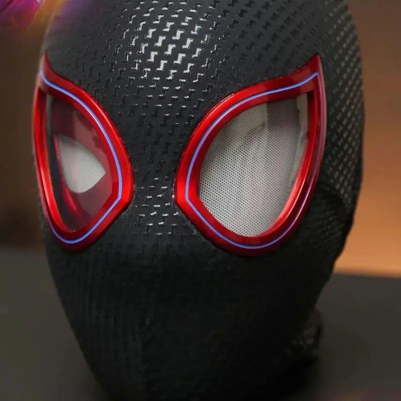 Cosplay mask detail close-up with textured black surface and red accents