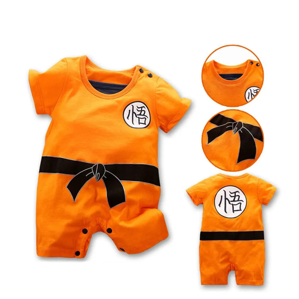Baby anime romper front view in orange with black bib and logo patch